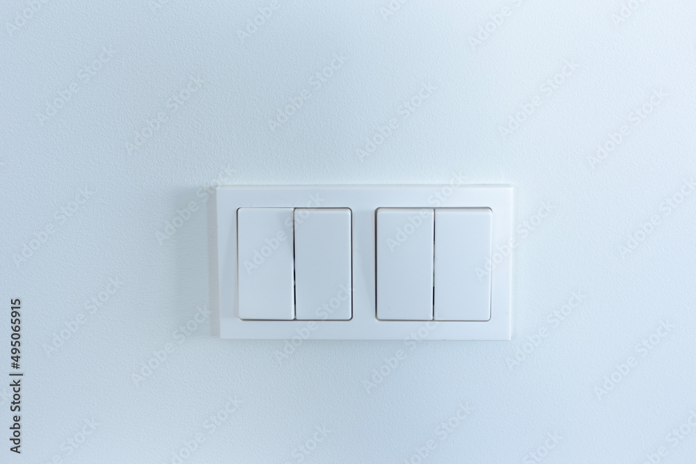 White light switches on a white wall White light switches on a white wall