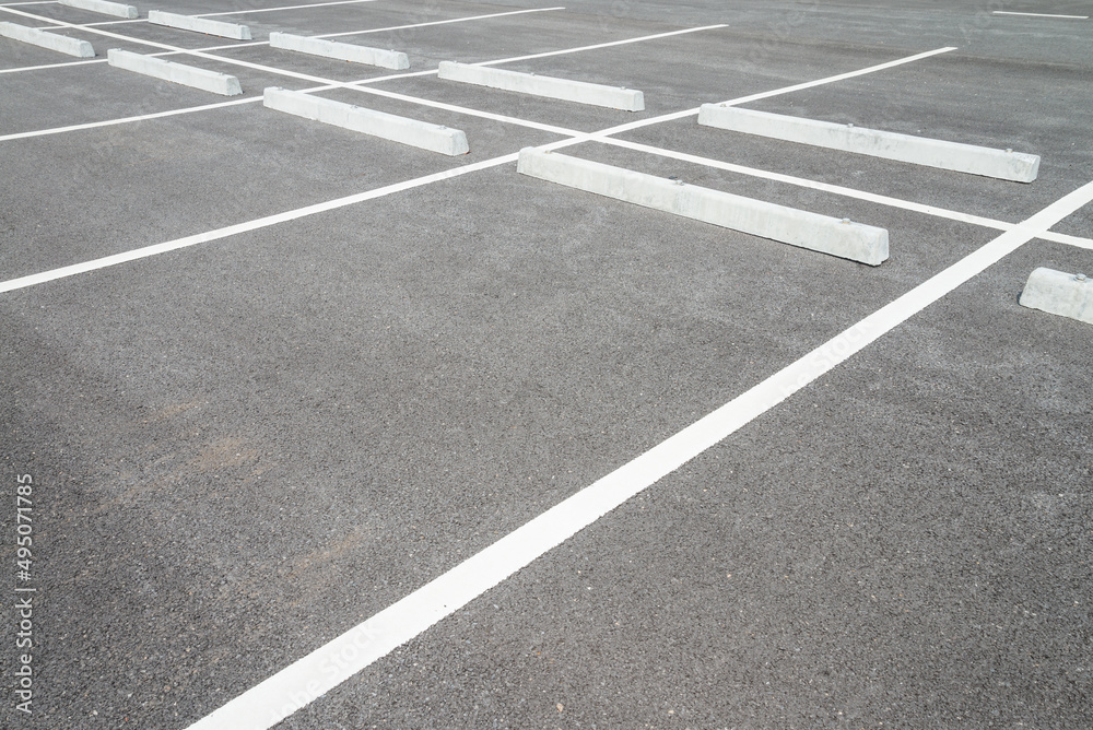 Empty space in outdoor asphalt car parking lot. Transportation concept.
