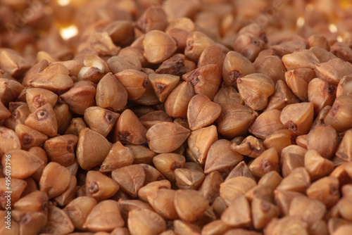 Close-up of buckwheat groats as background. © schankz