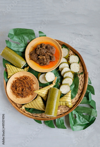 Traditional Muslim food popular among Malaysians. Lemang, Ketupat Palas, Beef Rendang and Beef Serunding Background. A dish eaten during Hari Raya