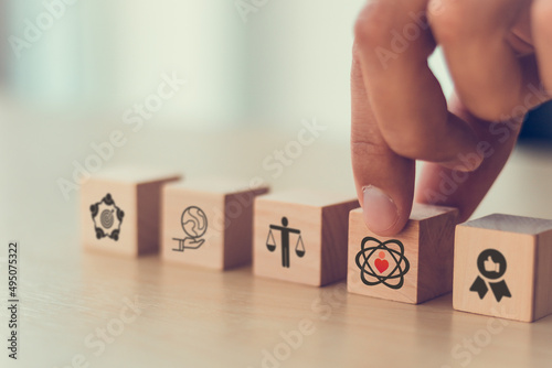 Core values,corporate values concept.  Company culture and strategy related to business, customer, people, company growth. Principles guide company's action. Core values icon on flat wood cube. Banner photo