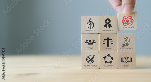 Core values,corporate values concept. Company culture and strategy related to business and customer relationships, growth. Principles guide company's action. Put wooden cubes with core values icons.