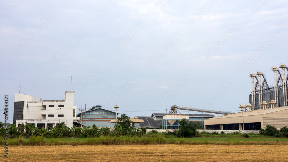 View of an old factory building used as a barn for steaming rice grains.