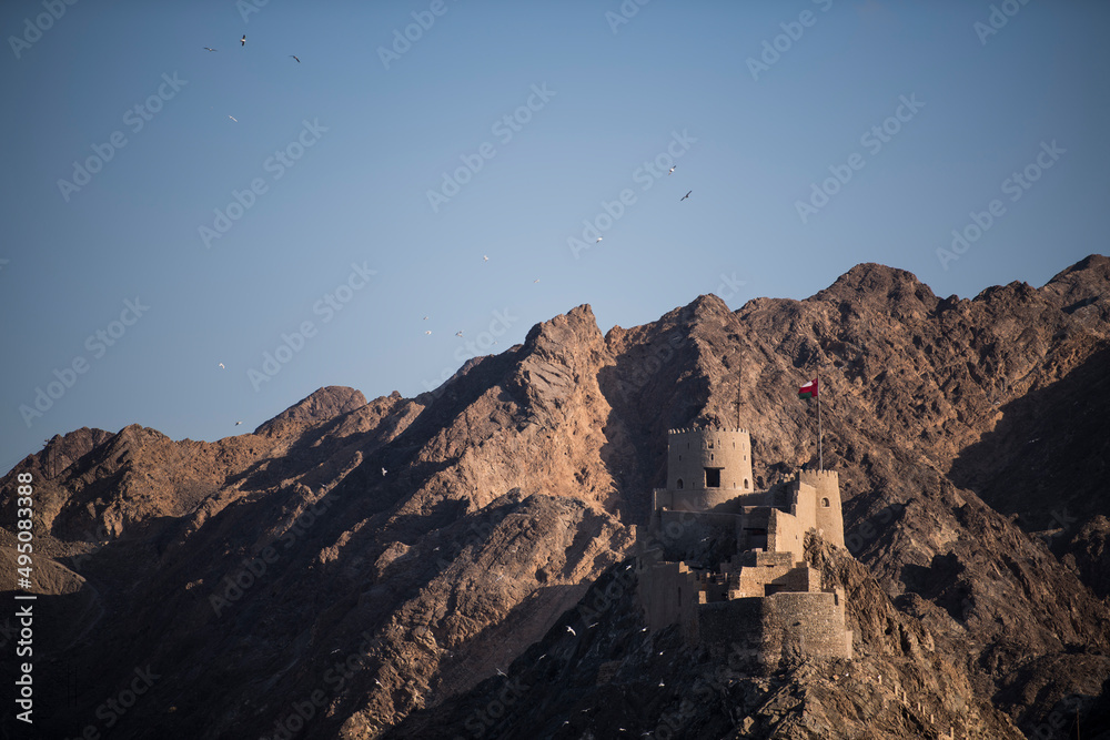 Muscat,Oman - March 05,2019 :Fortess on the hills surrounding the old town of Muttrah.
