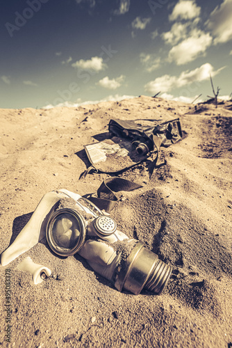 Damaged gas mask in danger and toxic desert.
