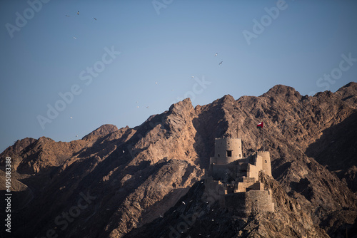 Muscat Oman - March 05 2019  Fortess on the hills surrounding the old town of Muttrah.