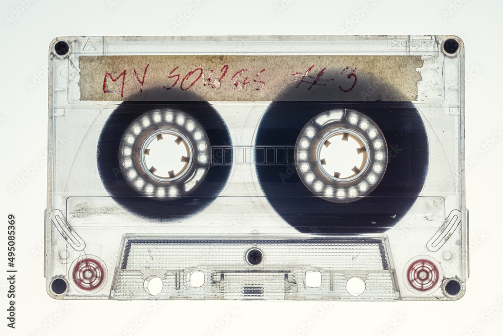 Fototapeta premium One old transparent audio cassette on white background