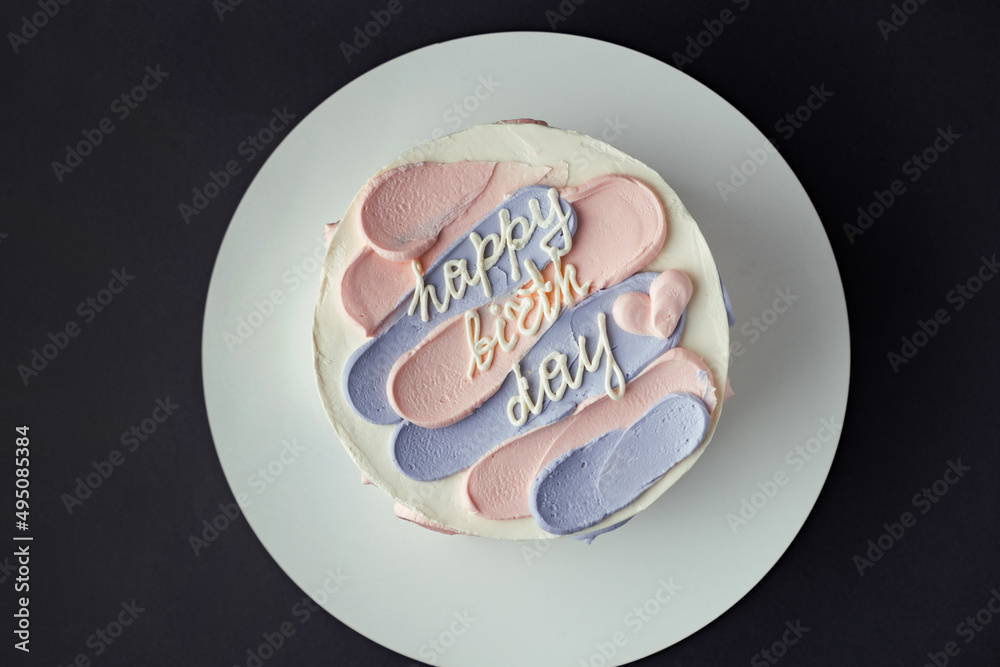 Bento cake with blue and pink cream cheese frosting and Happy birthday