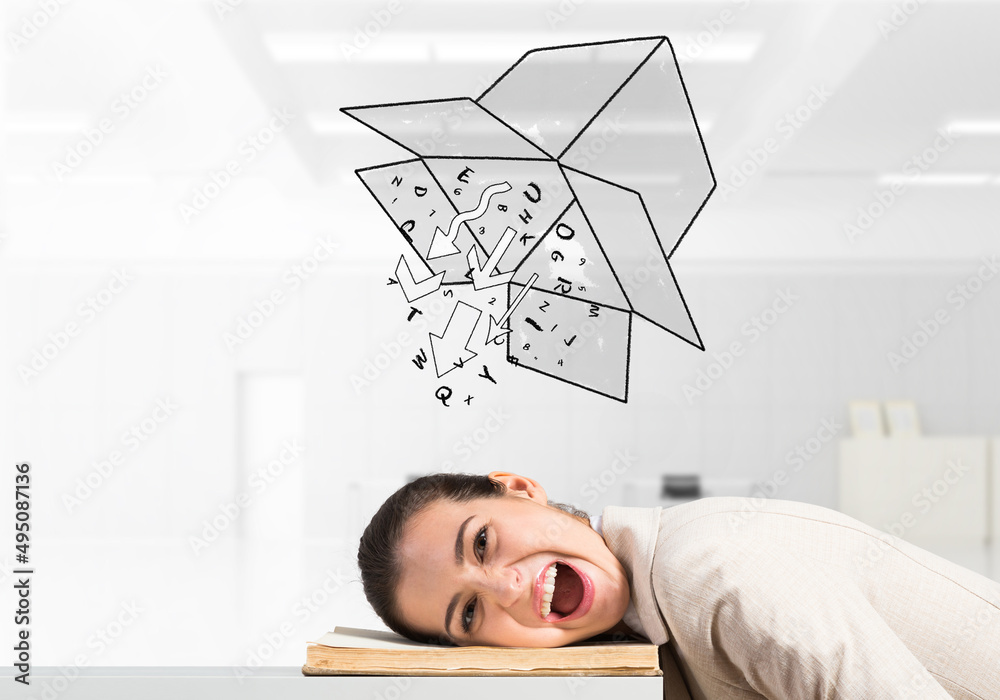 Obraz premium Business woman lying on desk with open mouth