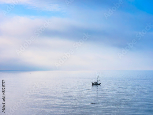 Lone Sailboat on a Misty Morning © susie peek
