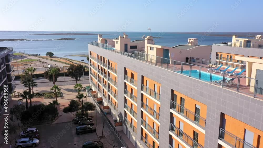 Aerial view of the urban area of portugal in the south of houses with modern infrastructure swimming pools overlooking the sea. Southern city of Portugal Olhao. Aerial view of the urban area of portugal in the south of houses with modern infrastructure swimming pools overlooking the sea. Southern city of Portugal Olhao.