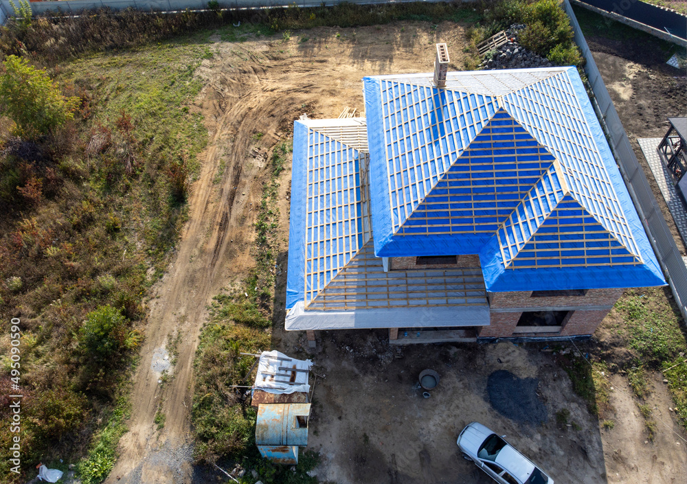 Roof under constructions with lots of tile and red brick chimney Roof under constructions with lots of tile and red brick chimney