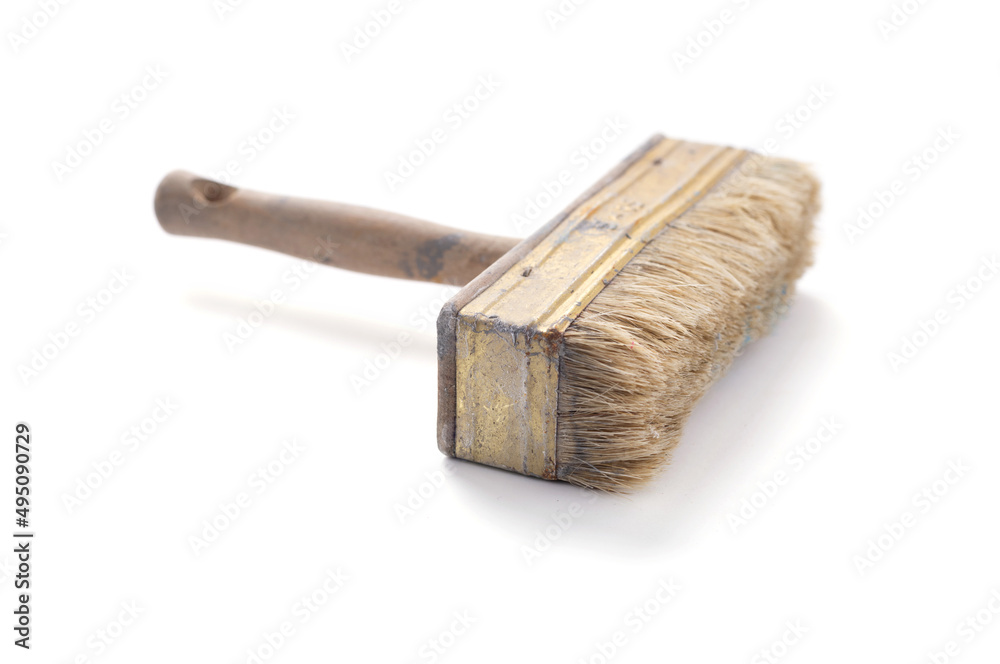 Old used paintbrush tool isolated at white background. Construction paint brush Old used paintbrush tool isolated at white background. Construction paint brush