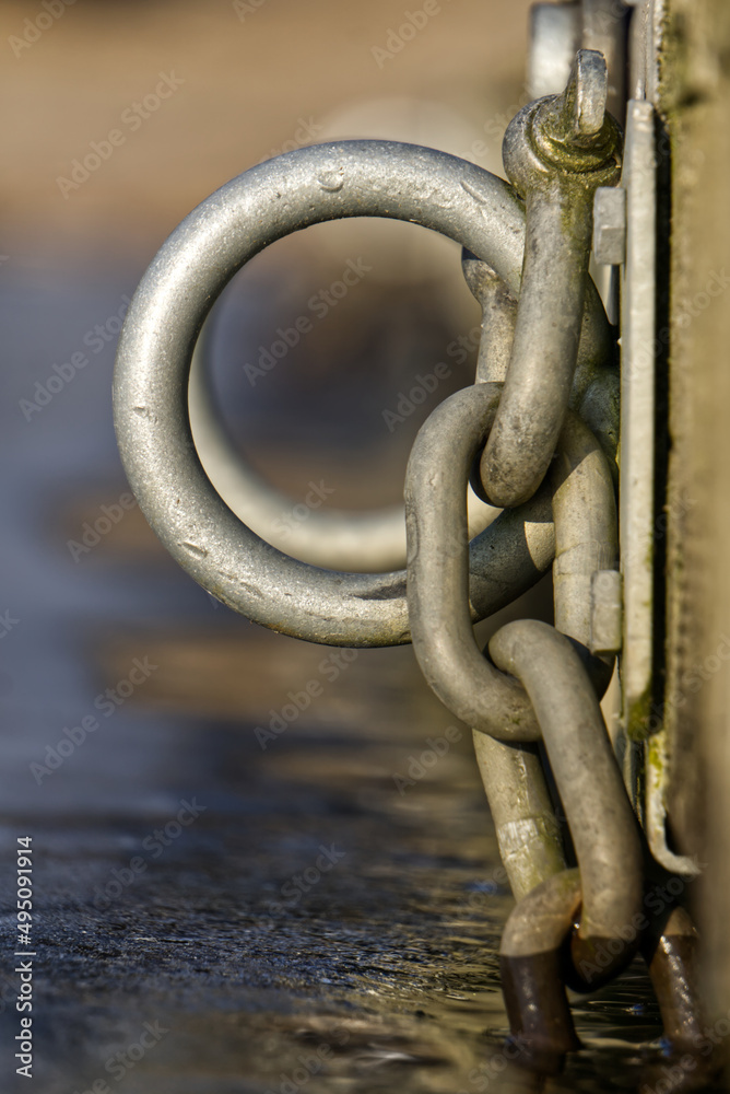 Metal rings on bridge with icy water Metal rings on bridge with icy water