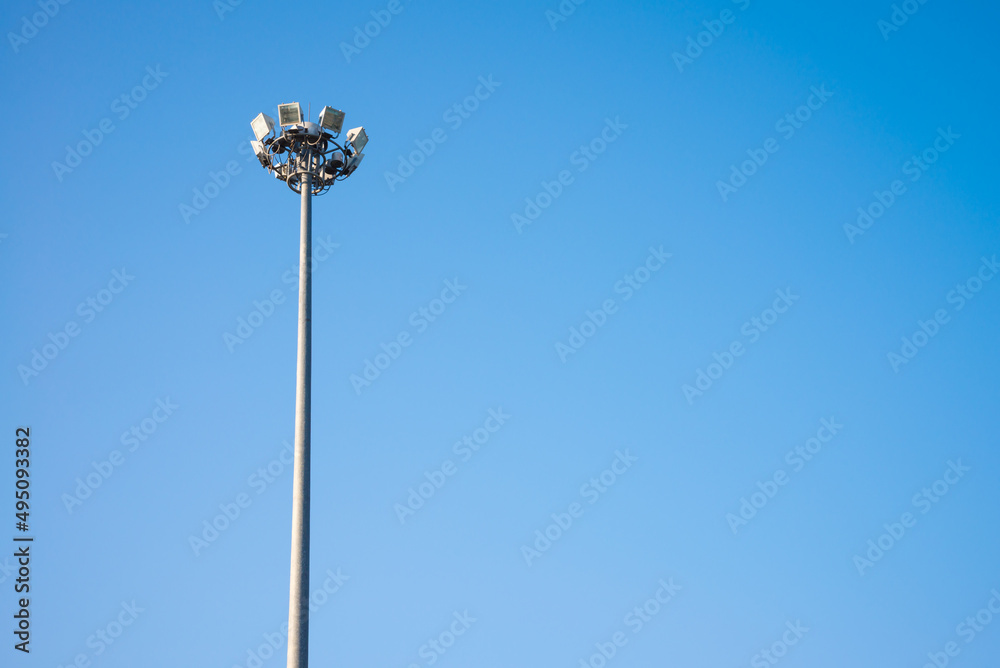 Light sport stadium in day time with clear blue sky background copy space.