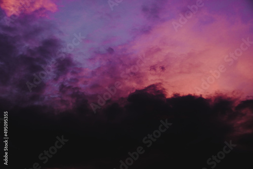 Dramatic colorful clouds in the sunset sky during sunset that resembles watercolors in a canvas