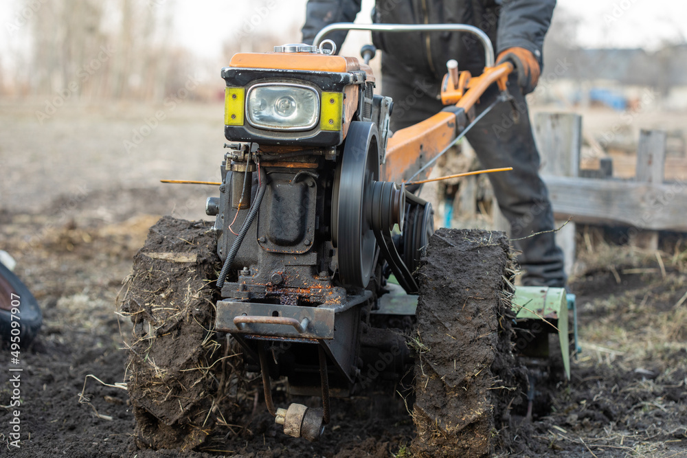 Fototapeta premium Garden tiller to work, walk-behind tractor