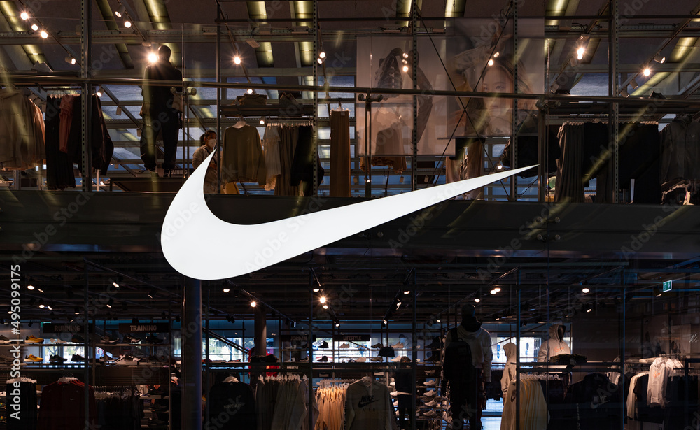 Rome, Italy - March 4, 2022: A picture of the large Nike logo on the window  of a clothing store. Stock Photo | Adobe Stock