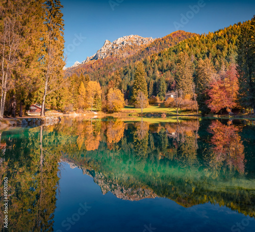 Fototapeta Naklejka Na Ścianę i Meble -  Calm morning view of Welsperg lake. Splendid autumn scene of Tonadico, Province of Trento, Italy, Europe. Astonishing landscape of Dolomite Alps. Beauty of nature concept background.