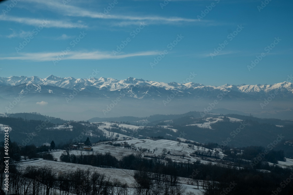 the snow-covered monviso mountain range in the Piedmontese Langhe near Alba, in January 2022