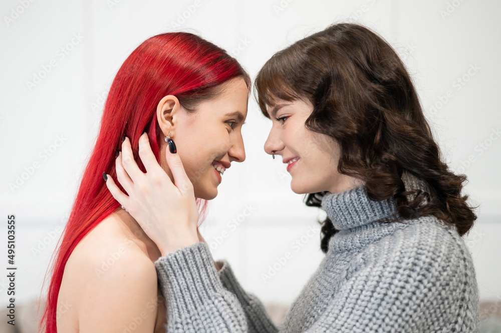 Fototapeta premium Young Caucasian women hugging tenderly. Same-sex relationships.