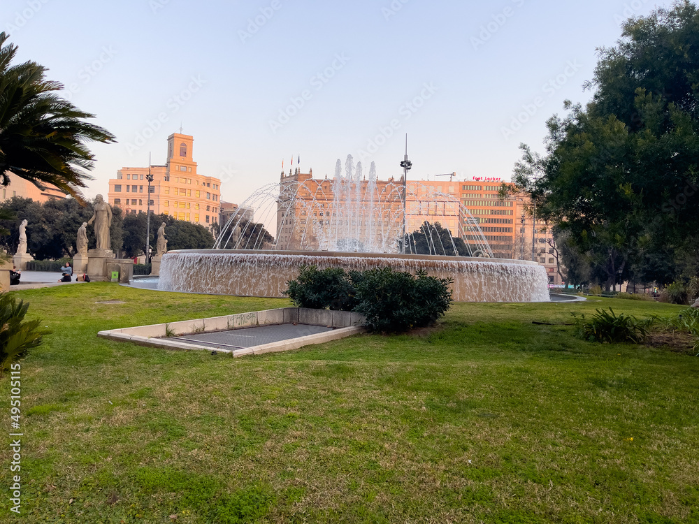 Beautiful circular fountain in a public garden in Barcelona