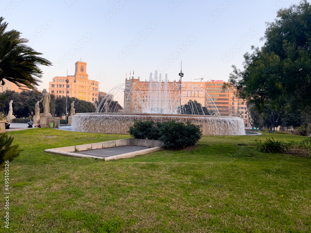 Beautiful circular fountain in a public garden in Barcelona