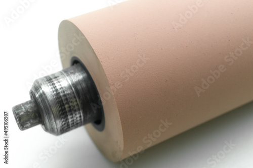 Anilox roller for flexographic printing machine. Raster cylinder for transferring ink to the printing roller. Selective focus, isolated on white photo