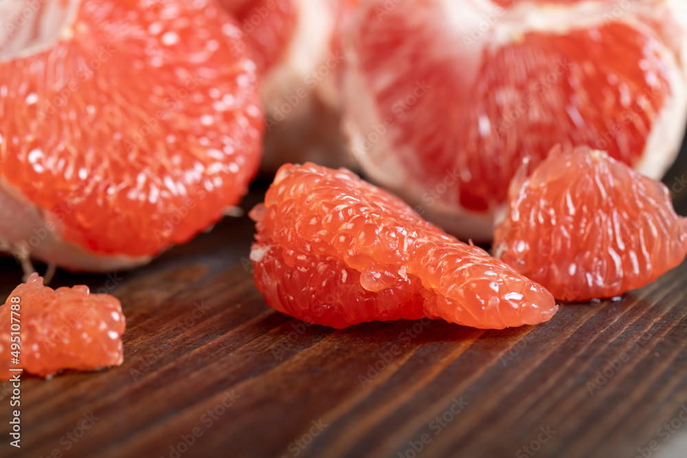 red ripe grapefruit on a cutting board red ripe grapefruit on a cutting board