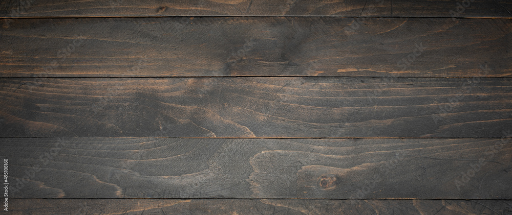 Naklejka premium Dark Wooden Black Stained Board Background Empty Space