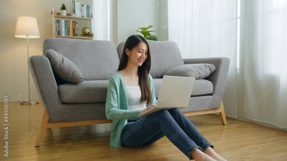 Young Asian woman using laptop computer for online working, studying, learning chatting in social media at home. Young Asian woman using laptop computer for online working, studying, learning chatting in social media at home.