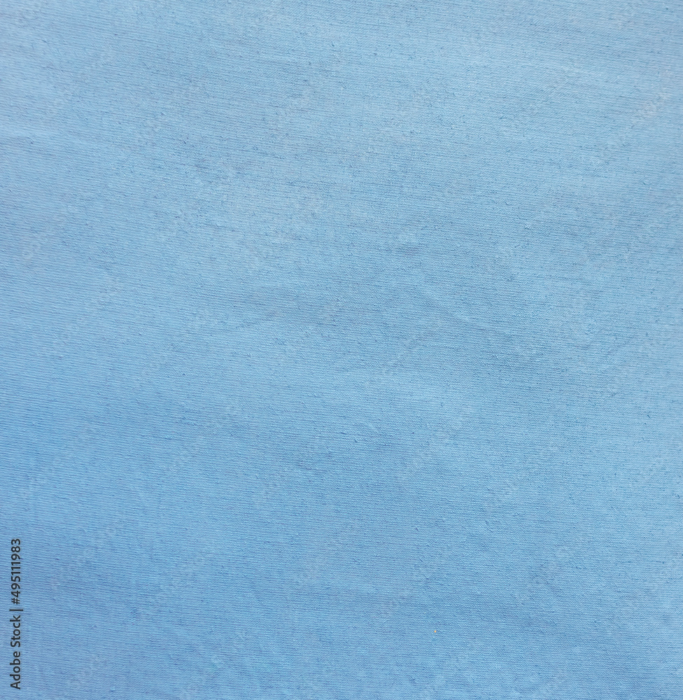 Naklejka premium Soft blue fabric surface. 