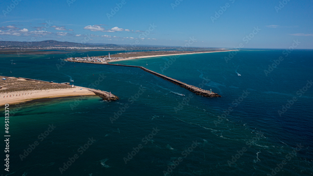 Fototapeta premium wide view of lighthouse in Ilha Deserta of Algarve