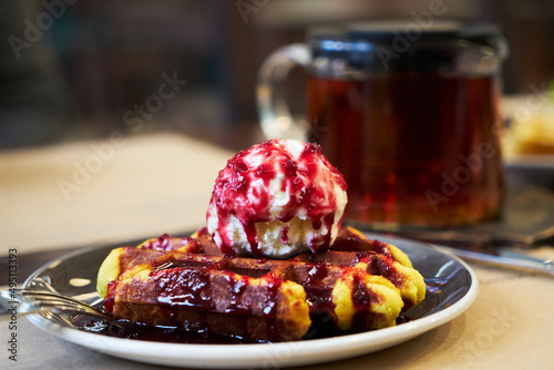 Brussels waffles with ice cream and jam. photo