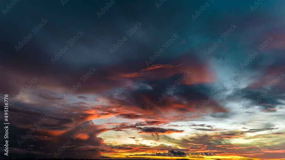 Obraz premium Dramatic sunset in the Sky through cumulus storm clouds, Timelapse. Awesome epic landscape. Amazing vibrant colors, in Goiania, Brazil