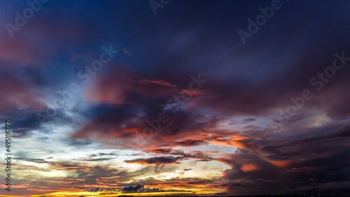 Dramatic sunset in the Sky through cumulus storm clouds, Timelapse. Awesome epic landscape. Amazing vibrant colors, in Goiania, Brazil