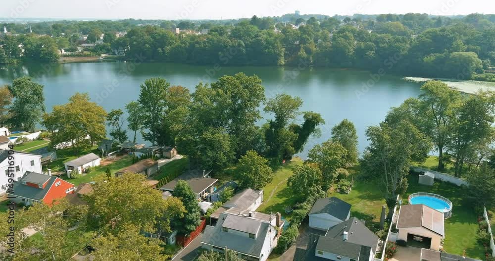 Panorama over viewed residential house area urban development residential near small pond in Sayreville New Jersey US Panorama over viewed residential house area urban development residential near small pond in Sayreville New Jersey US