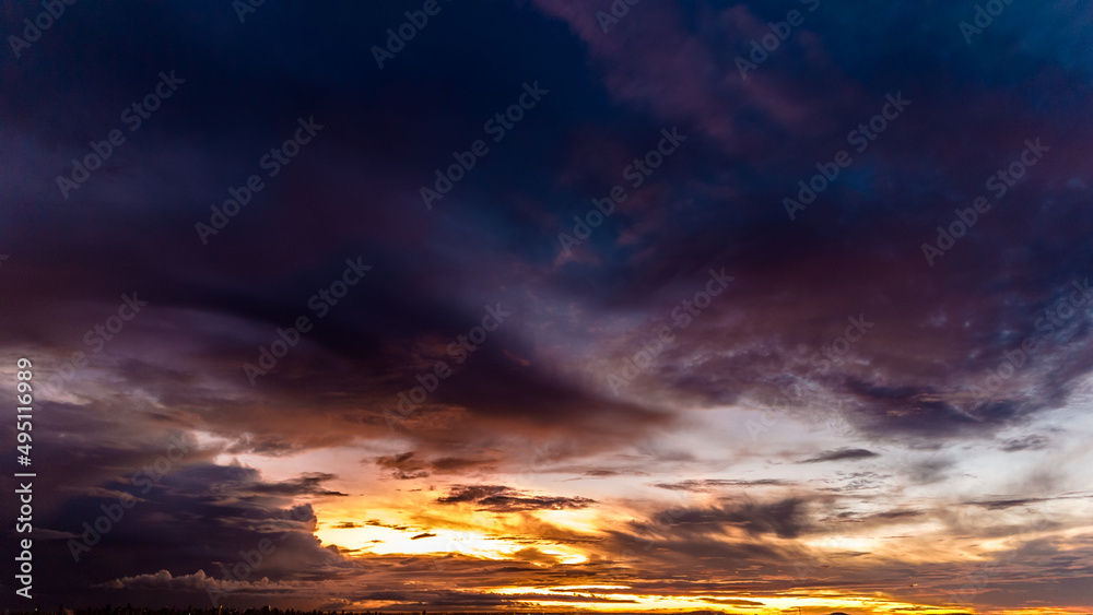 Obraz premium Dramatic sunset in the Sky through cumulus storm clouds, Timelapse. Awesome epic landscape. Amazing vibrant colors, in Goiania, Brazil