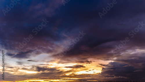 Fototapeta Naklejka Na Ścianę i Meble -  Dramatic sunset in the Sky through cumulus storm clouds, Timelapse. Awesome epic landscape. Amazing vibrant colors, in Goiania, Brazil