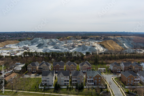 Fototapeta Naklejka Na Ścianę i Meble -  Aerial view of the Potomac Edge subdivision in Rockville, Montgomery County, Maryland. The neighborhood is adjacent to an active quarry.