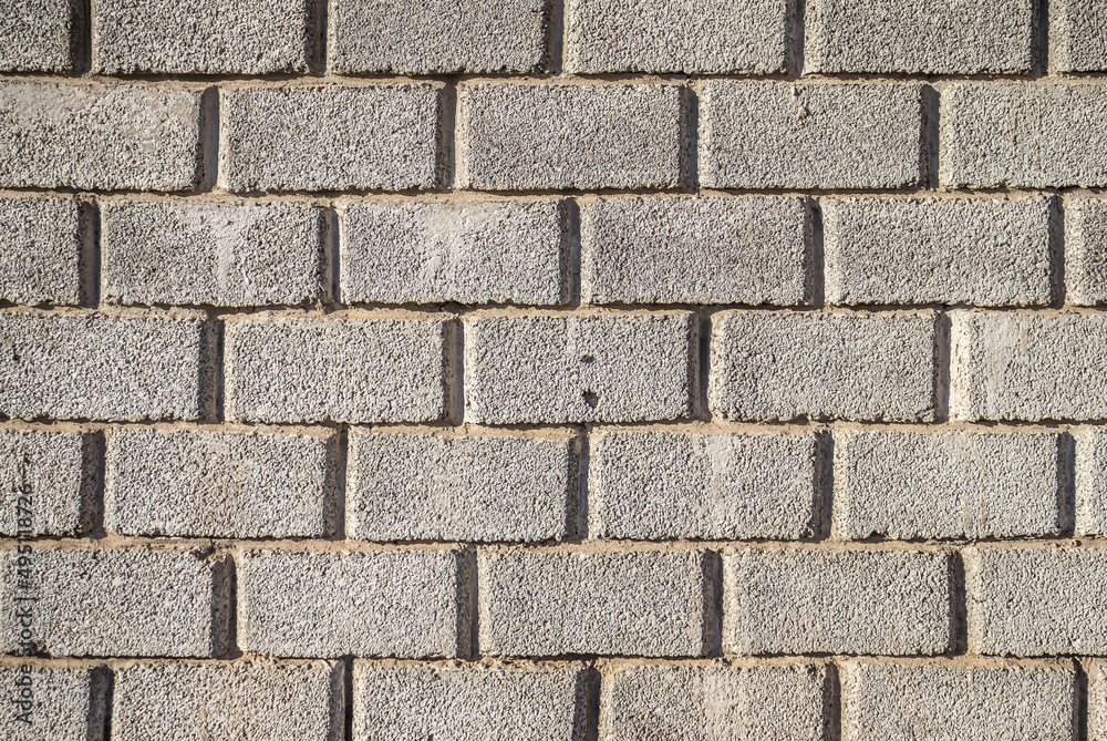 Gray cinder block wall surface as background Gray cinder block wall surface as background