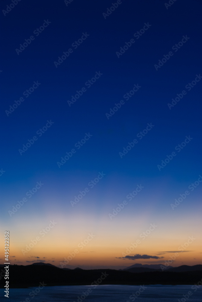 Sunset over a lake in a tropical landscape