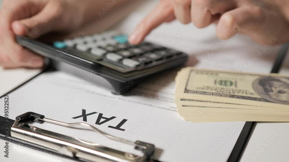 calculation of taxes. A man's hand counts amounts on calculator. Tax individuals and legal entities. Budgeting. Accounting for expenses and income. calculation of taxes. A man's hand counts amounts on calculator. Tax individuals and legal entities. Budgeting. Accounting for expenses and income.