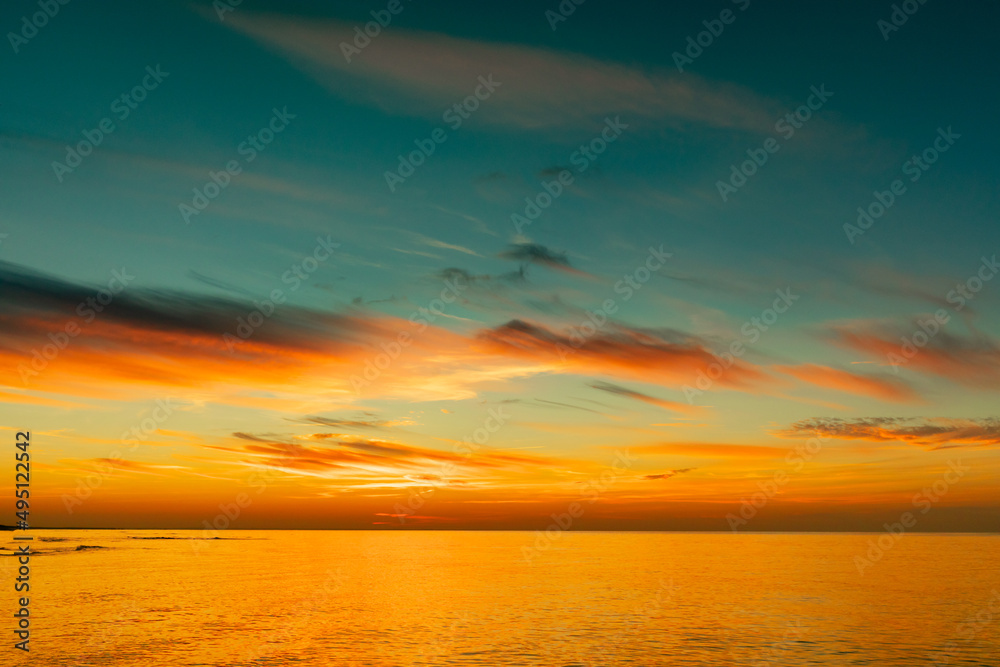 Beautiful cloudy sky at sunset on the sea
