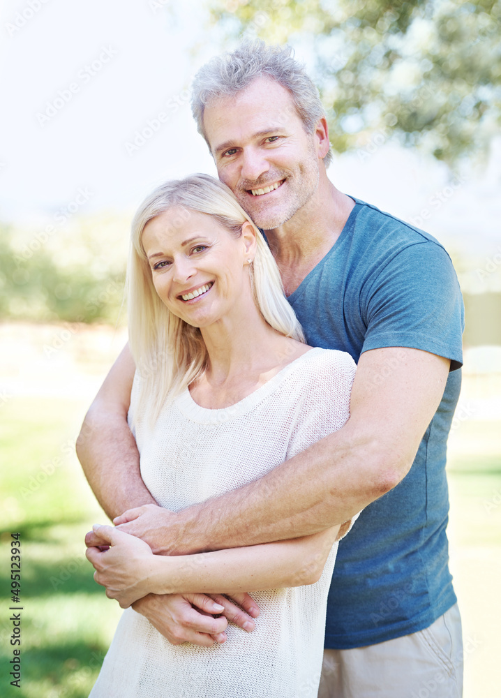 They mean the world to each other. A lovely mature couple enjoying a day out together in the park. They mean the world to each other. A lovely mature couple enjoying a day out together in the park.