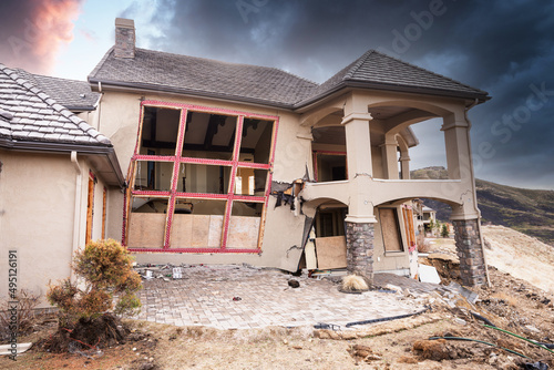 Natural disaster slowing breaking a house into pieces