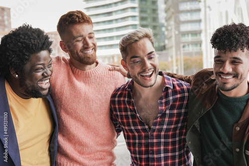 Multiracial boys having fun in the city - Diverse young men and friendship concept photo