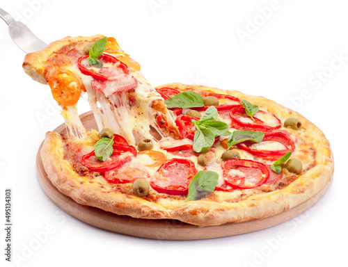 Hot cheese stringy slice lifted of full baked pizza isolated on white background photo