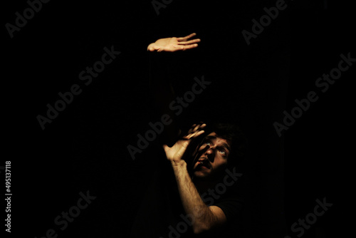 Young man trying to get out of depression and darkness