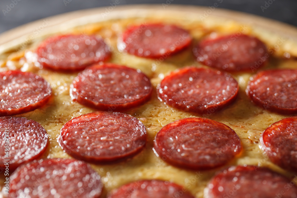 Obraz premium Pepperoni pizza whole, close-up, selective focus.
